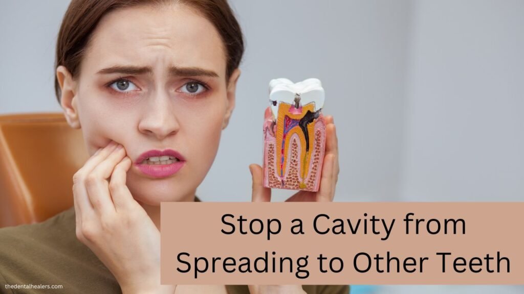 How to Stop a Cavity from Spreading to Other Teeth a person holding a teeth with dental cavity and feeling pain